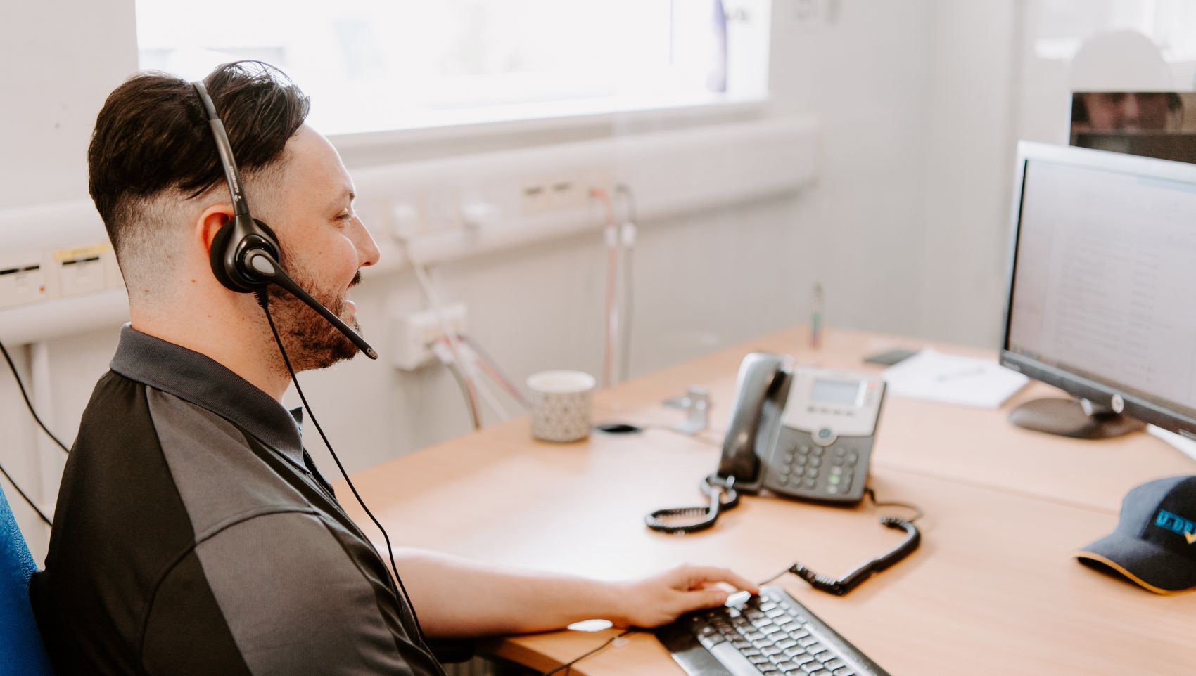 U-Drive central reservations team member wearing a headset.jpg